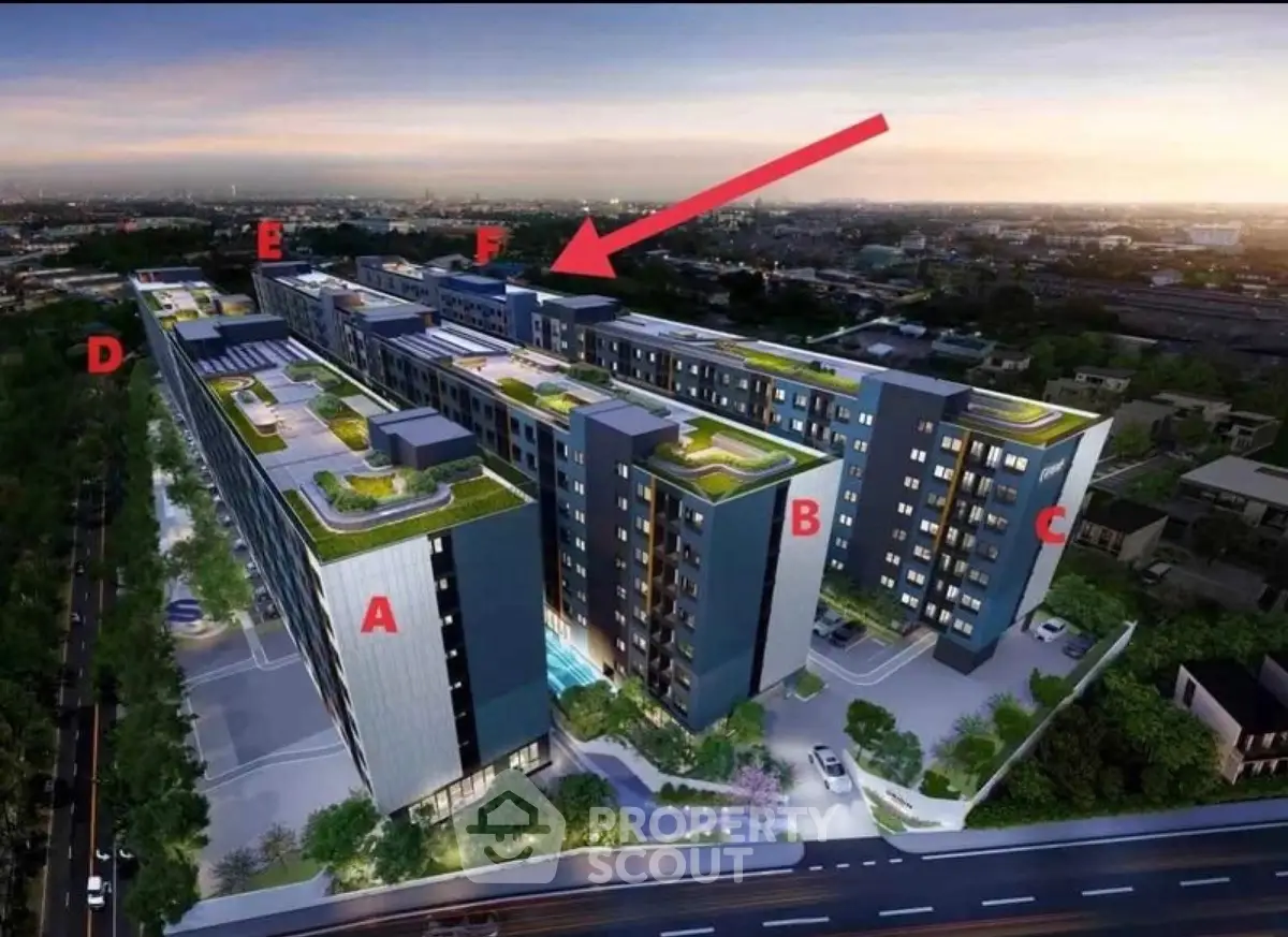 Modern apartment complex with rooftop gardens and city view at dusk.
