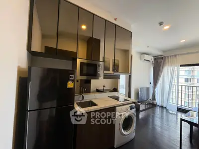 Modern kitchen with sleek appliances and open layout in a stylish apartment