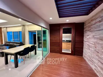 Modern open-plan living and dining area with stylish decor and natural light.