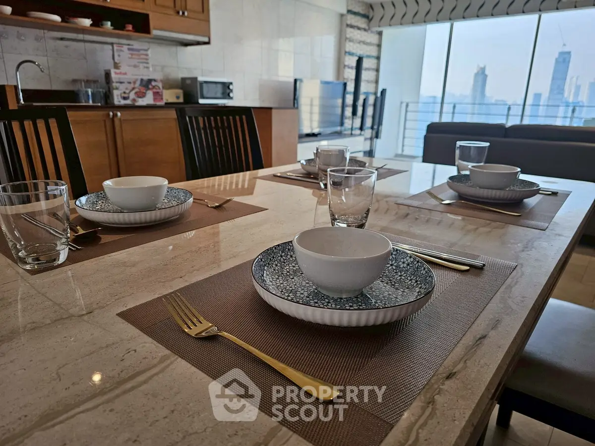 Luxurious dining setup in modern kitchen with city view