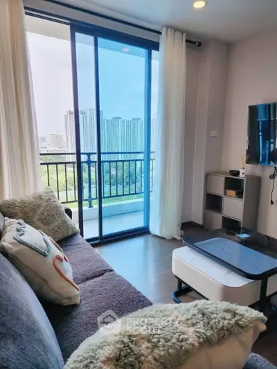 Modern living room with balcony view in high-rise apartment