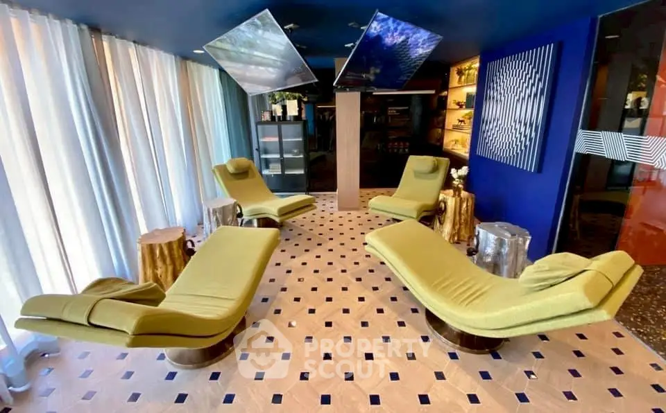 Luxurious modern lounge with stylish green recliners and elegant decor