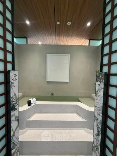 Luxurious onsen-style bathroom with elegant marble accents and serene ambiance.