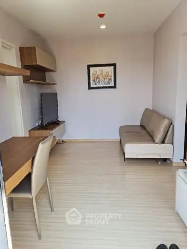 Modern living room with sleek furniture and wall art, perfect for urban living.