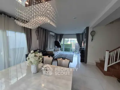 Elegant living room with modern chandelier and stylish decor