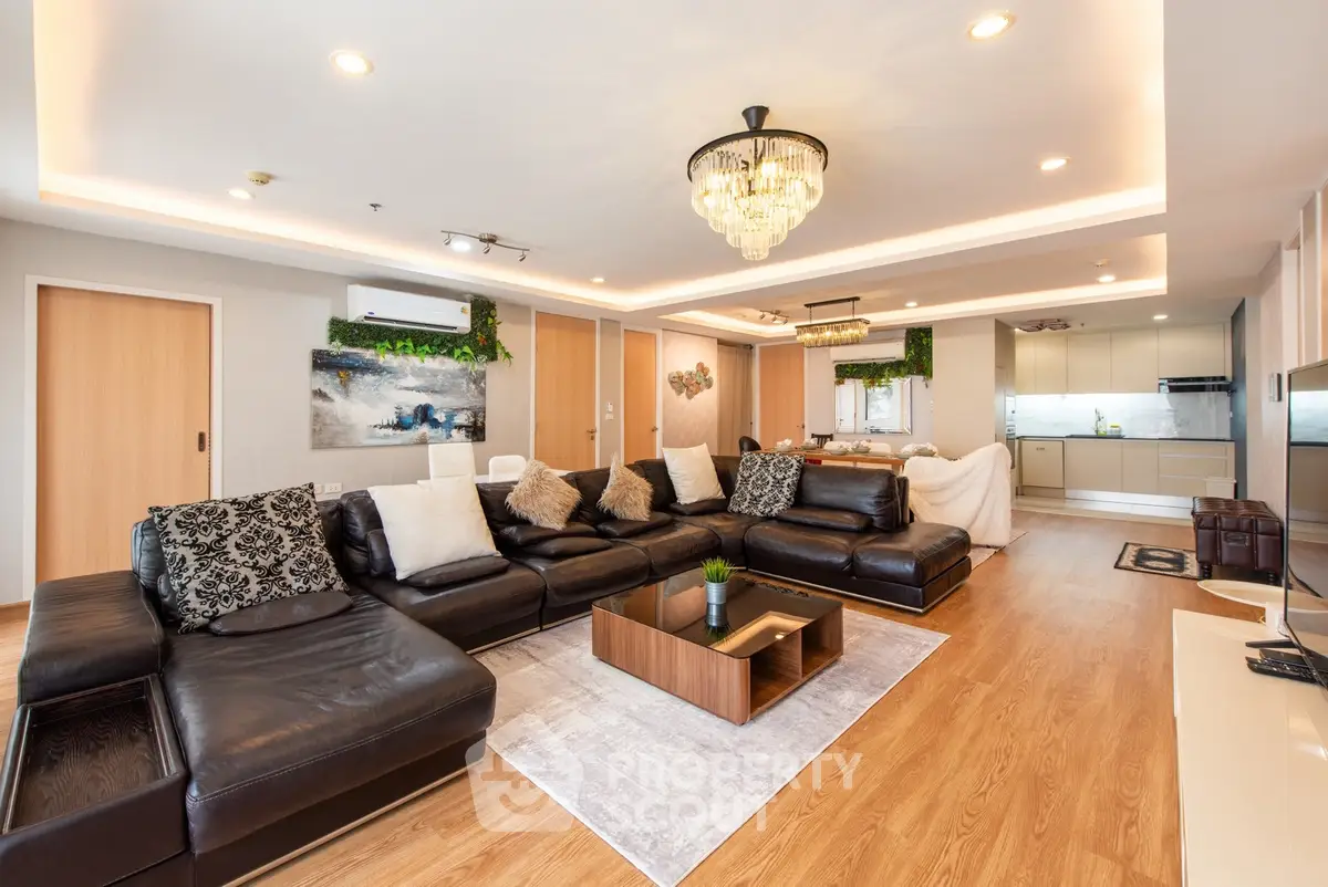 Luxurious open-plan living room with elegant decor and modern kitchen