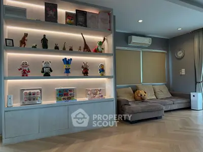 Stylish living room with display shelves and cozy seating area