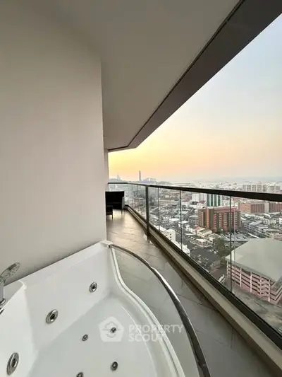 Luxurious balcony with jacuzzi and stunning city view at sunset