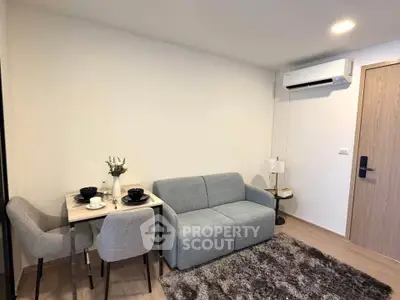 Modern living room with cozy sofa and dining area in stylish apartment