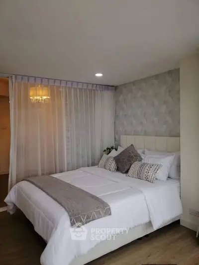 Elegant bedroom with modern decor and soft lighting, featuring a cozy bed and stylish curtains.