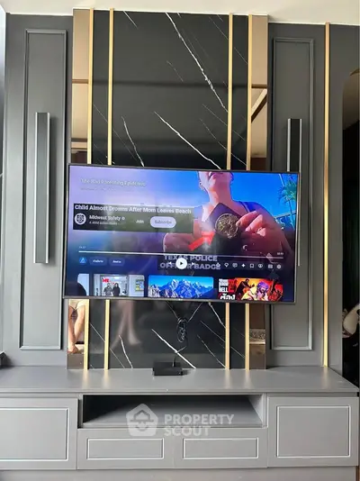 Modern living room with sleek TV setup and stylish wall design