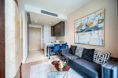 Modern living room with stylish decor and open kitchen layout