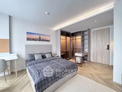 Modern bedroom with stylish decor and walk-in closet in a luxury apartment.