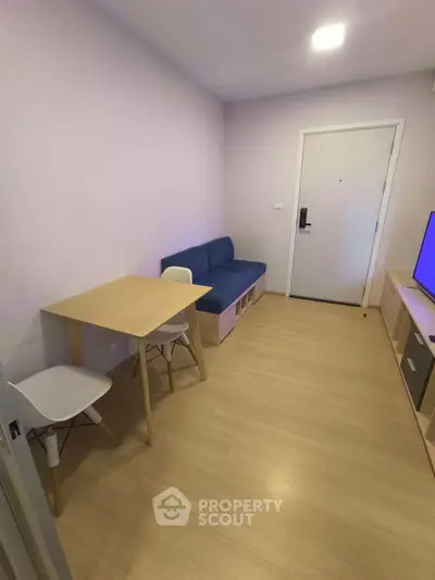 Cozy living room with minimalist furniture and wooden flooring