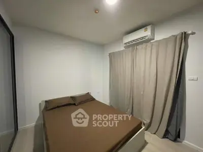 Cozy bedroom with air conditioning and minimalist decor, perfect for restful nights.