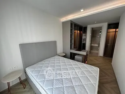 Modern bedroom with stylish furniture and ample natural light