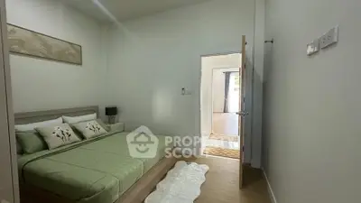 Cozy bedroom with green bedding and modern decor in a bright apartment