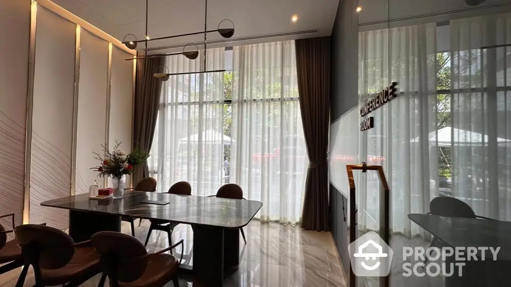 Elegant dining room with modern decor and large windows offering natural light