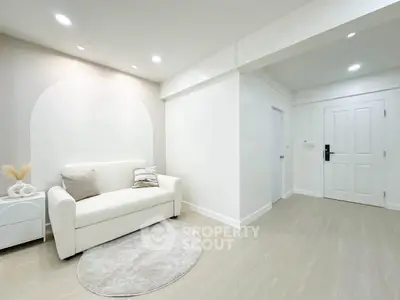 Modern minimalist living room with white sofa and stylish decor