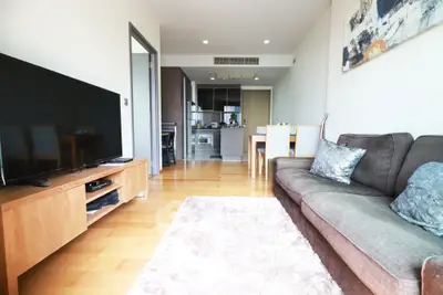 Spacious modern living room with open kitchen and cozy decor