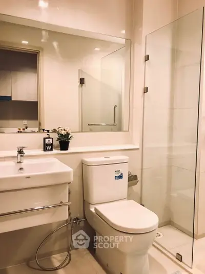 Modern bathroom with glass shower and sleek fixtures