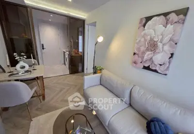 Modern living room with elegant decor and open kitchen layout