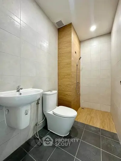 Modern bathroom with sleek fixtures and wood accents