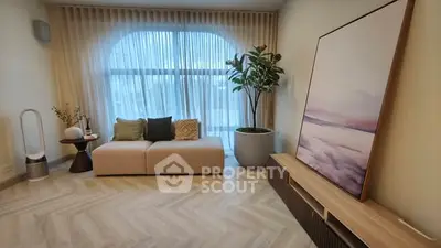 Elegant living room with modern decor and large window