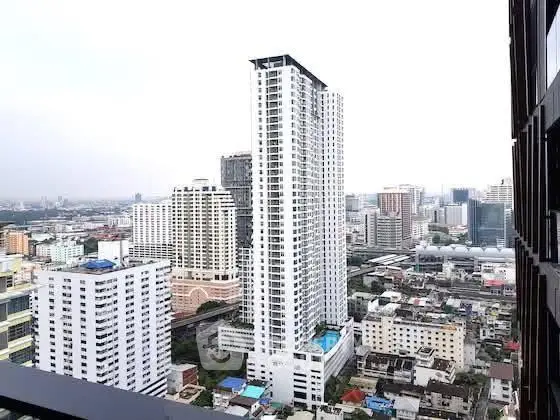 Stunning cityscape view from high-rise balcony showcasing modern urban living.