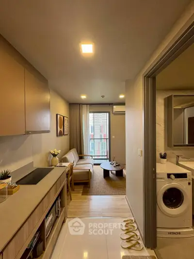 Modern apartment interior with cozy living room and kitchen, featuring stylish decor and natural light.