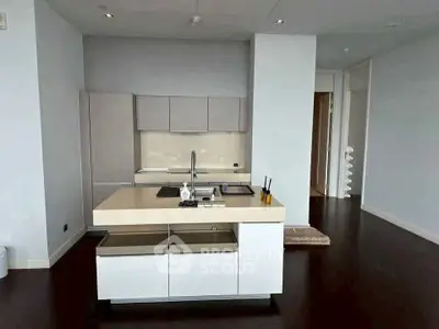 Modern kitchen with sleek design and island in upscale apartment