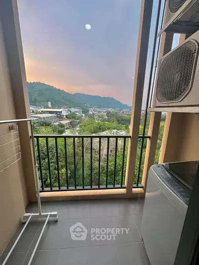 Charming balcony with scenic view and laundry area in modern apartment