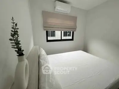 Cozy bedroom with air conditioning and modern decor