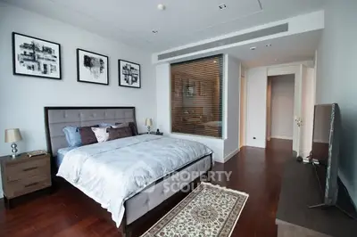 Luxurious modern bedroom with elegant decor and hardwood flooring