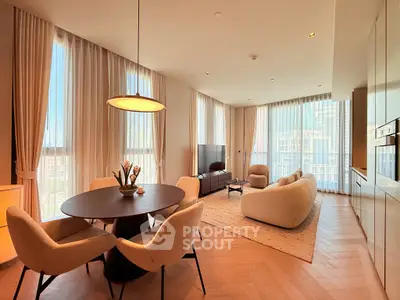 Luxurious modern living room with elegant furniture and large windows offering city views.
