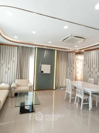 Modern living room with elegant dining area and stylish furniture