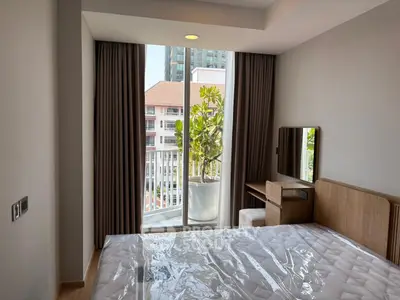 Modern bedroom with balcony view in urban apartment