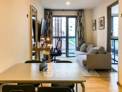 Modern living room with stylish decor and balcony view