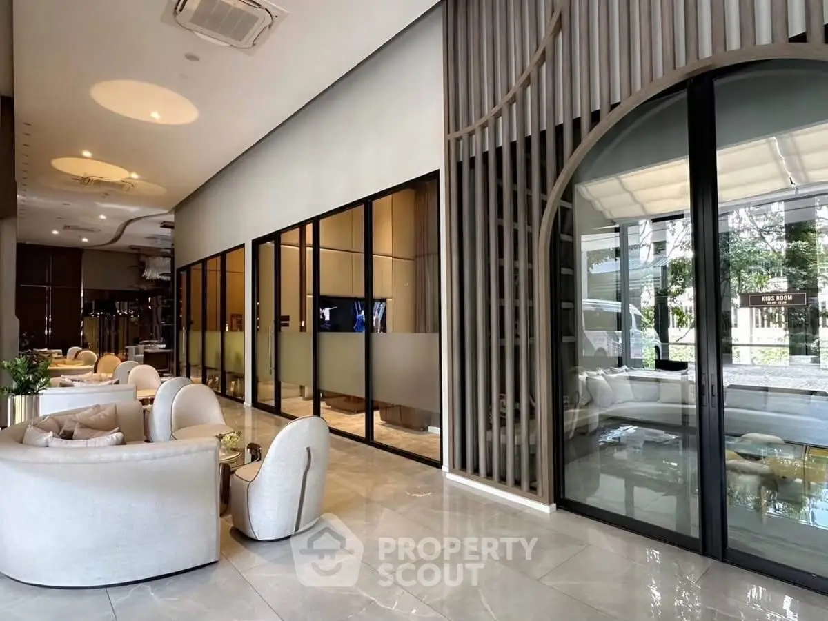 Luxurious modern living room with elegant seating and glass partitions