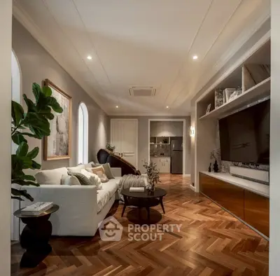 Luxurious living room with elegant decor and modern entertainment center