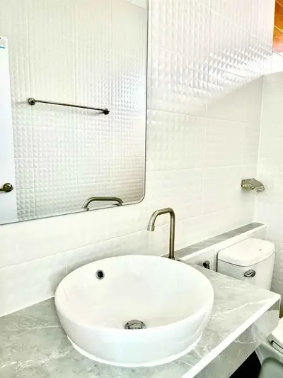 Modern bathroom with elegant white sink and stylish fixtures
