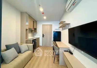 Modern living room with sleek furniture and integrated kitchen area