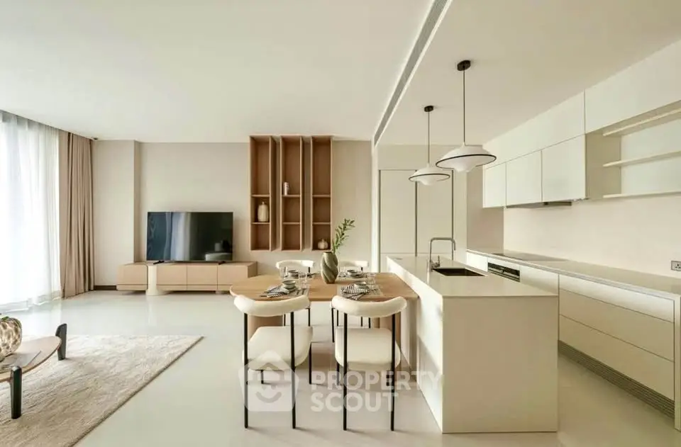 Modern open-plan living room and kitchen with sleek design and natural light