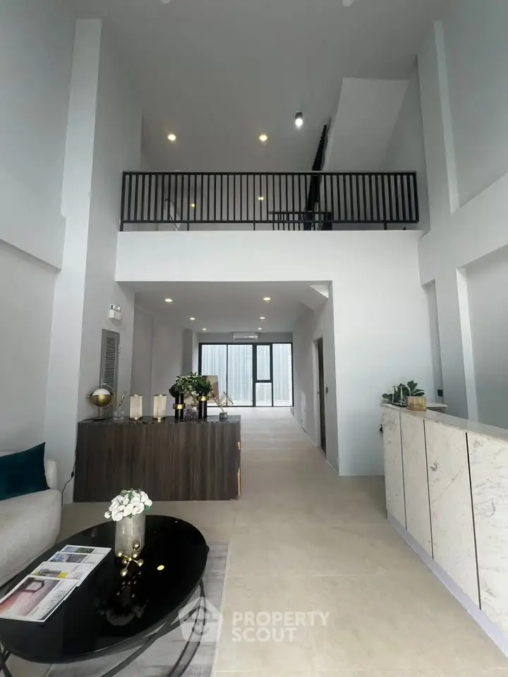 Spacious modern living room with high ceilings and elegant decor