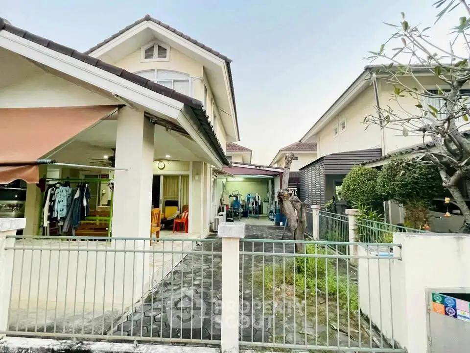 Charming suburban home with spacious driveway and lush greenery