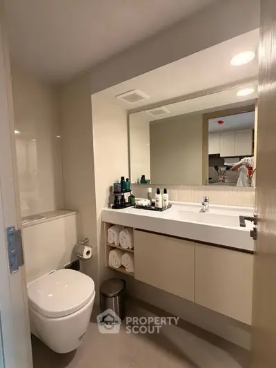 Modern bathroom with sleek fixtures and ample storage space