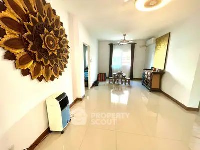 Spacious living room with elegant decor and natural light