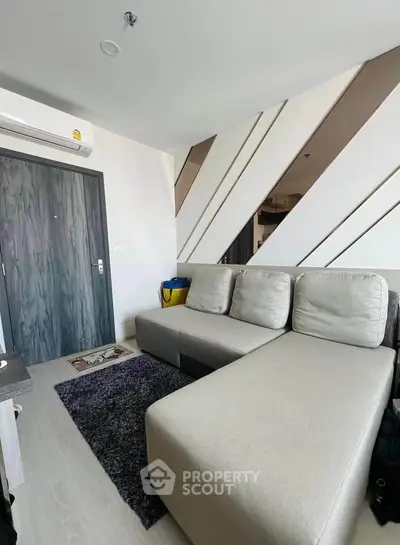 Modern living room with stylish sectional sofa and contemporary decor