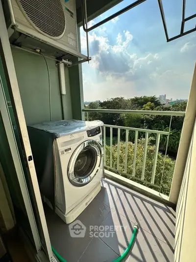 Charming balcony with washing machine and scenic view, perfect for urban living convenience.