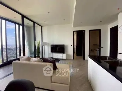 Modern living room with panoramic city view and sleek interior design.